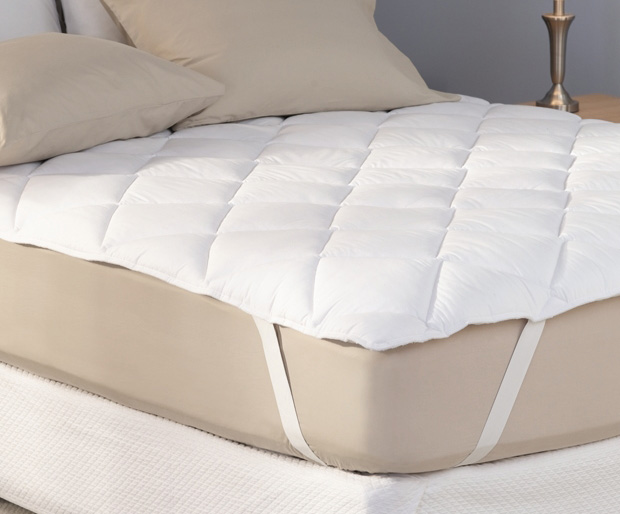 Image result for picture of a bed with a mattress pad
